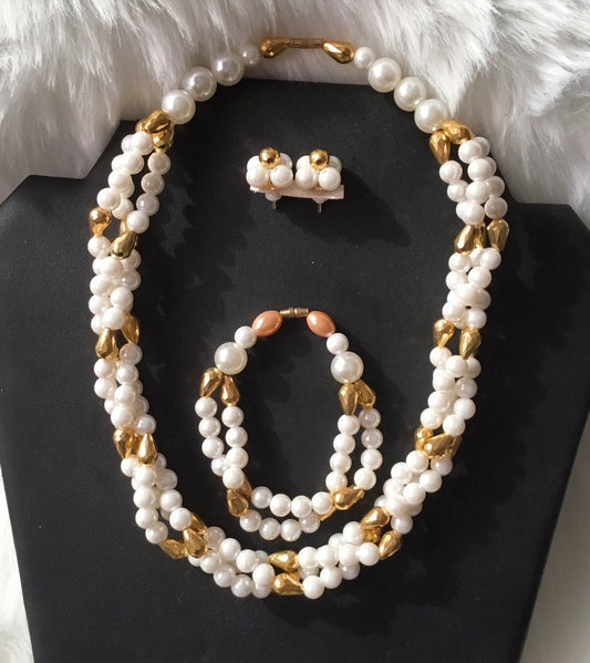 Three Row Faux Pearl Necklace, Earrings And Bracelet.
